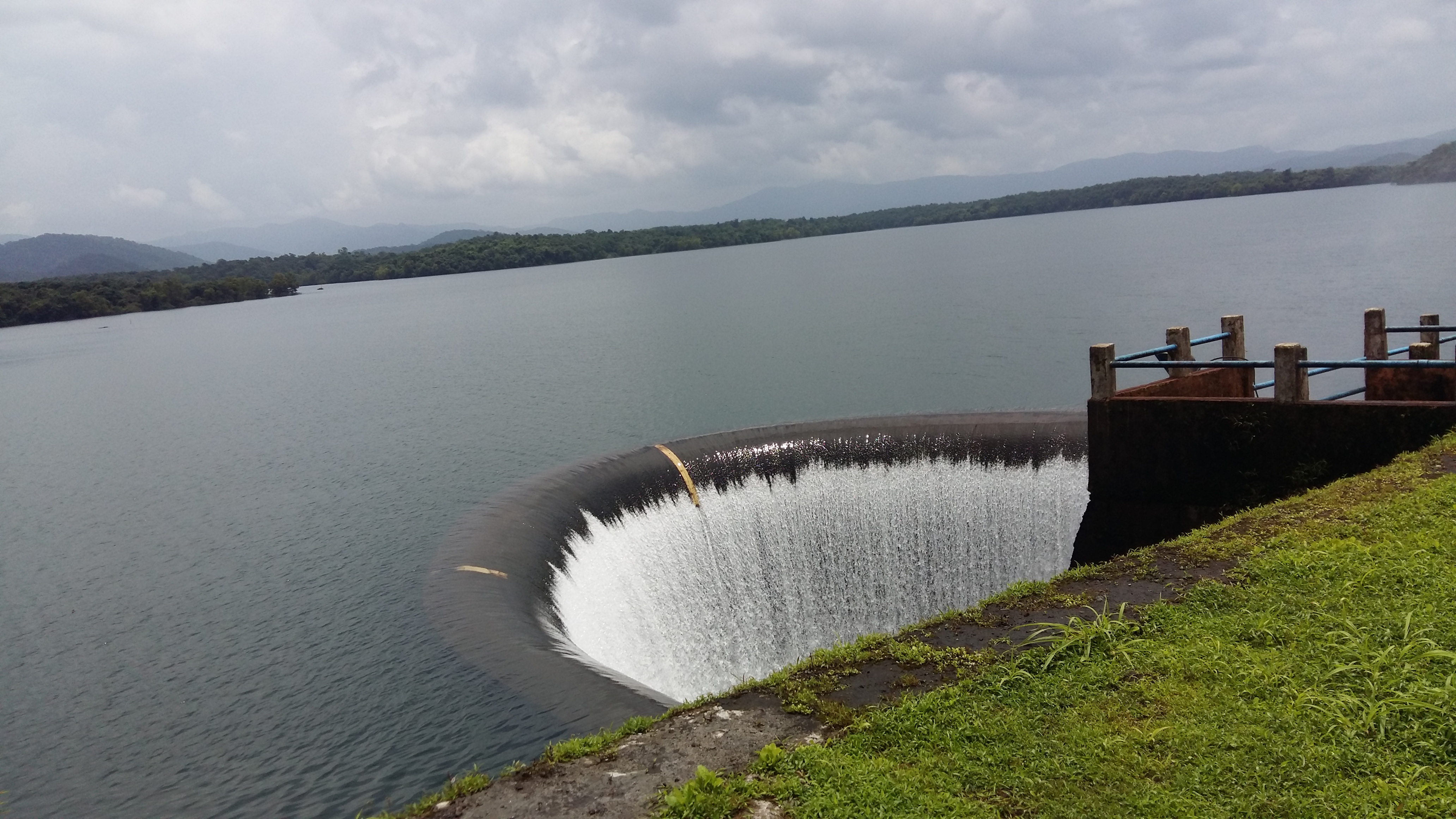 Salaulim Dam reservoir in South Goa, the state's largest dam, with its expansive water body surrounded by lush green forested hills